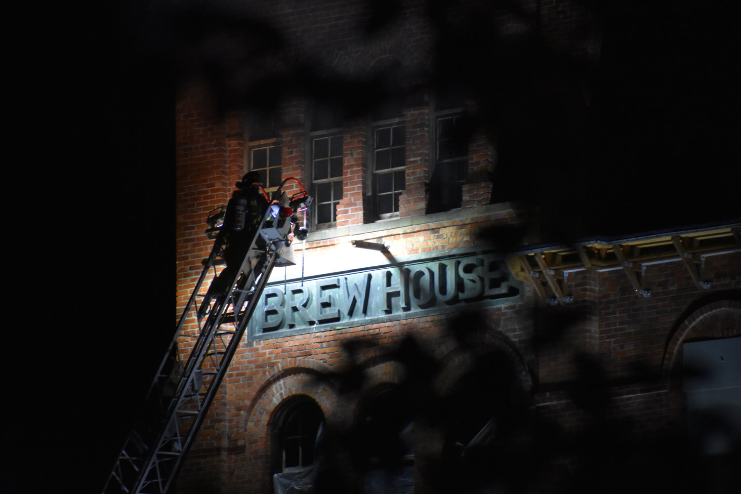 A firefighter puts out a fire at the Old Brewery Tower in Tumwater on June 6. The Tumwater Police Department determined the cause of the fire to be arson.